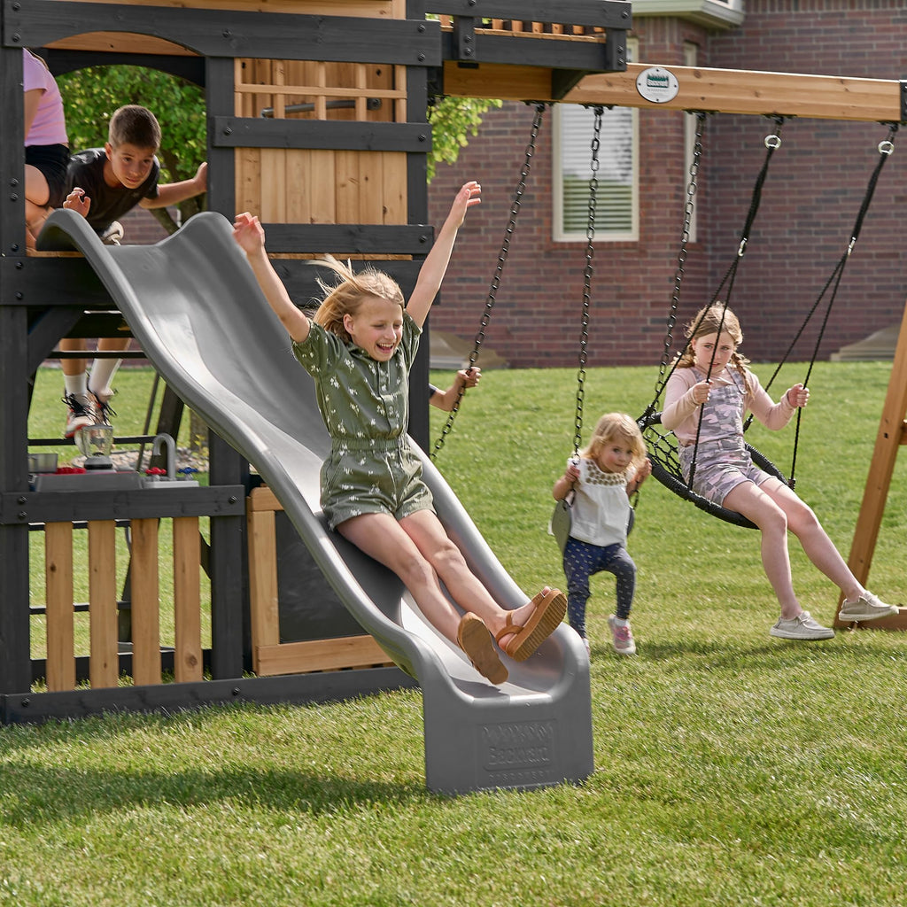 Backyard Discovery Rosewood Falls Cedar Wood Swing Set with Monkey Bars, Clubhouse, Crow's Nest, Play Kitchen, Wave Slide, Rock Wall, Belt Swings, Web Swing, Half Door, Chalkboard, Outdoor Playset